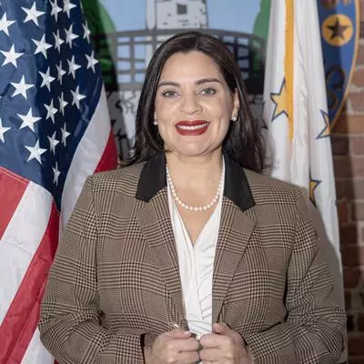 Headshot Mayor with Flags.jpg Central Falls Mayor Maria Rivera